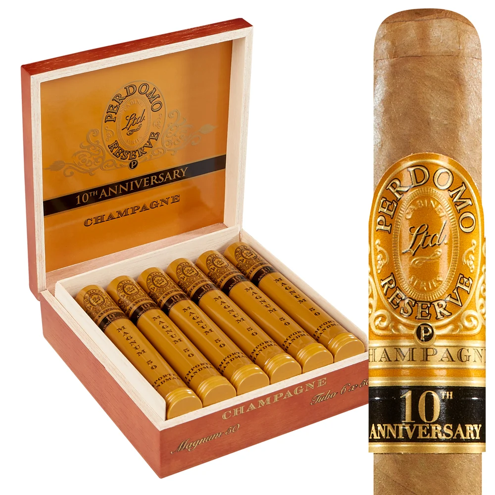 Perdomo 10th Anniversary Champagne cigars displayed in an open wooden box with gold interior alongside a single cigar showing the gold band